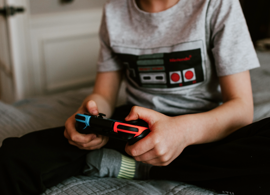 Child holding game controller